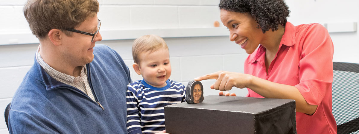 An infant participates in a research study about perceptual development