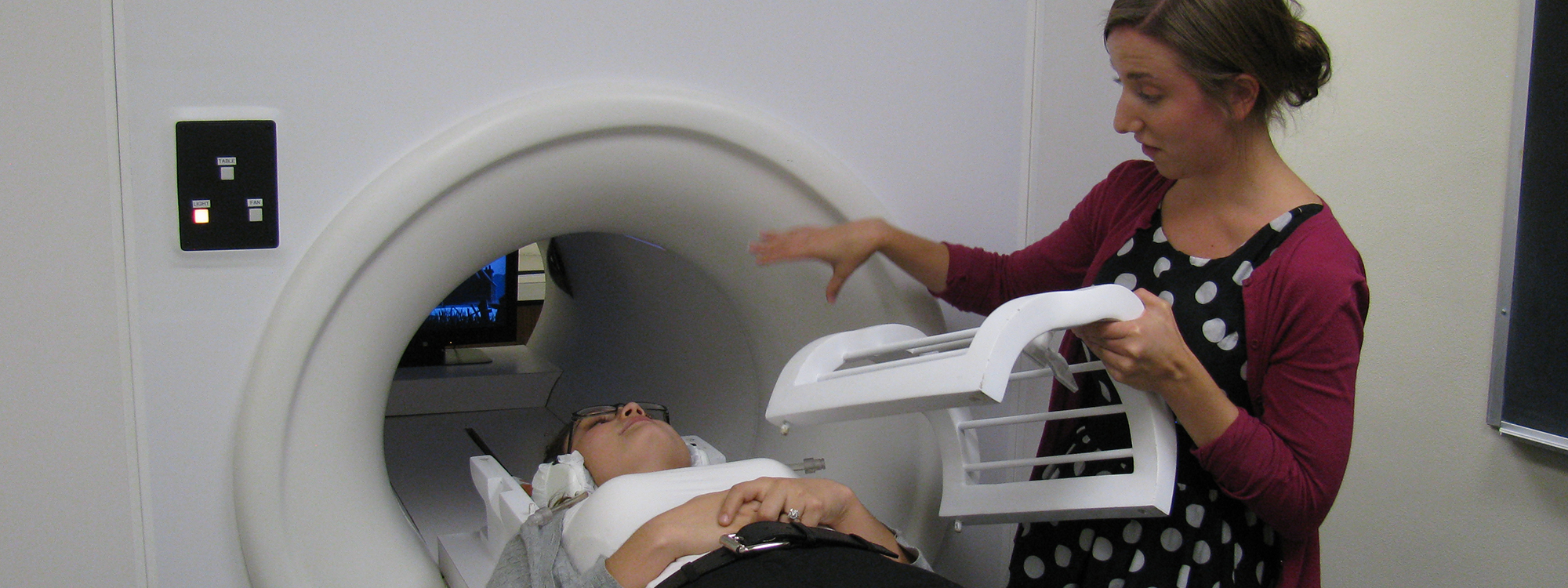 An adolescent prepares to enter an MRI as part of a research study